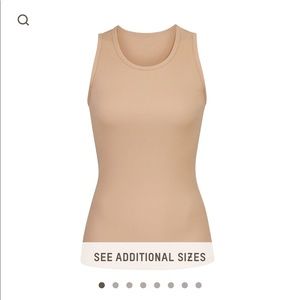Skims boyfriend tank in color ochre size small. NWT